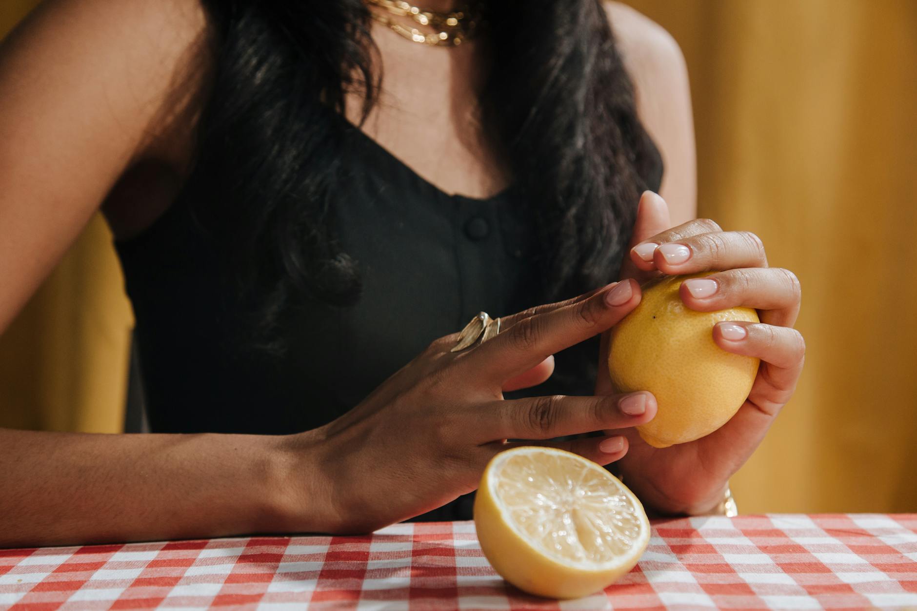 Bright yellow lemons on a soft pastel background, symbolizing freshness and new beginnings
