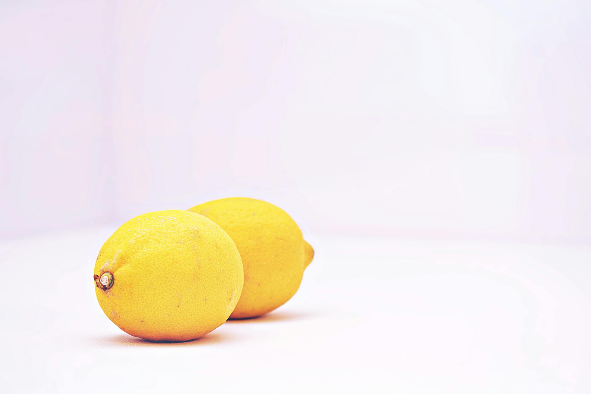 Colorful arrangement of clitoral vibrators on a bright yellow background, showcasing diverse shapes and design options.