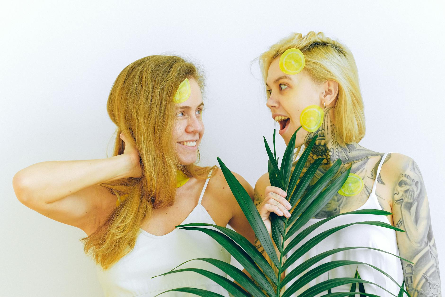 Two women smiling and laughing together, representing body positivity and cycle awareness