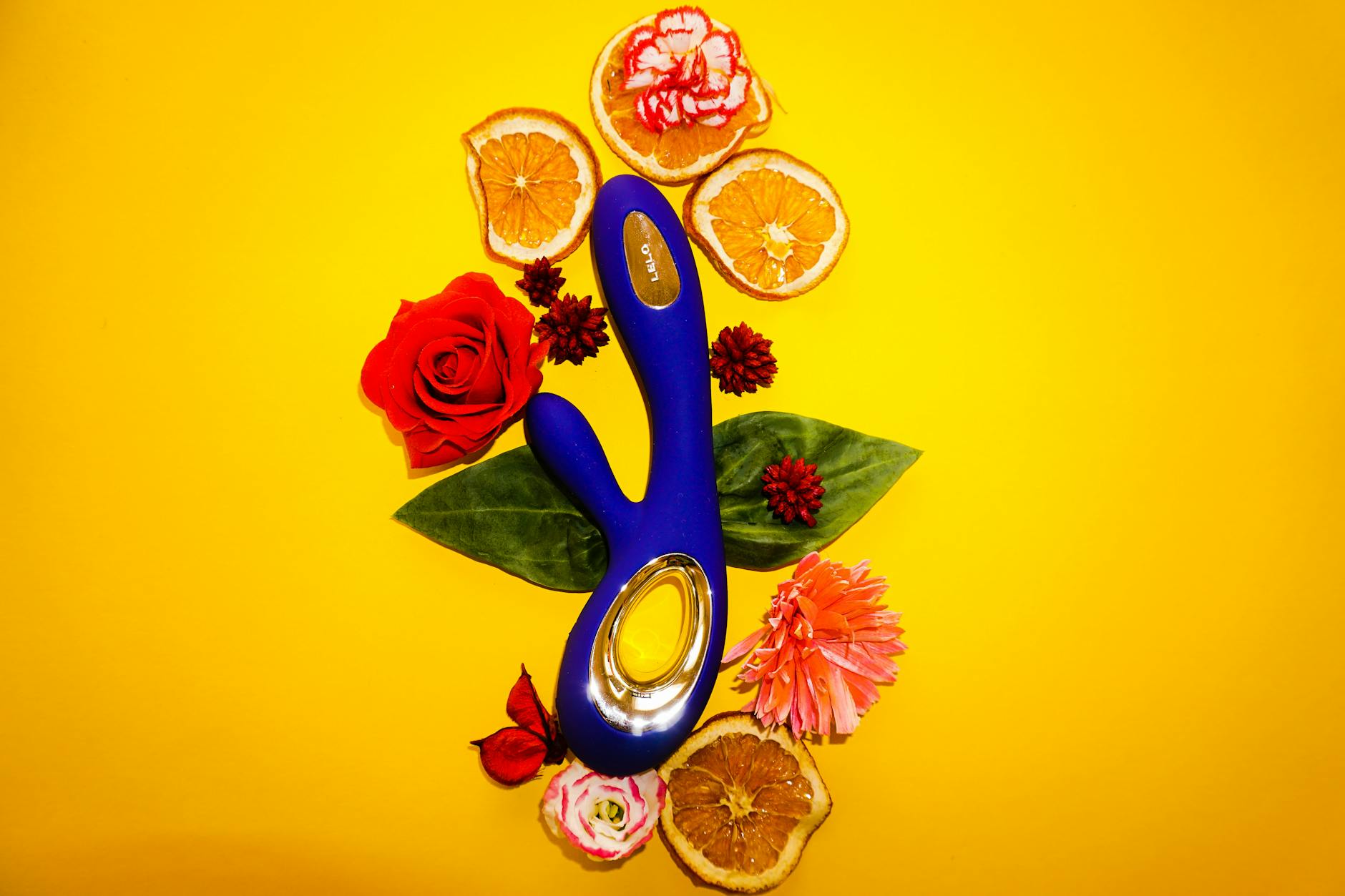 Close-up of hands holding a sleek blue clitoral vibrator